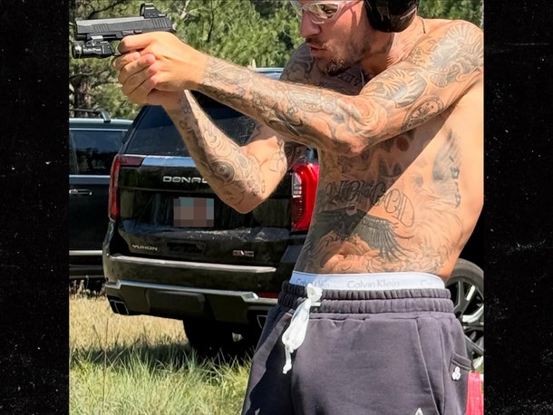 Justin Bieber Shooting Guns Shirtless