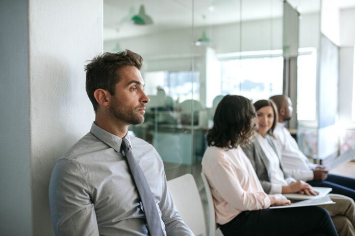 man-using-tips-for-introverts-while-waiting-for-his-job-interview.jpg