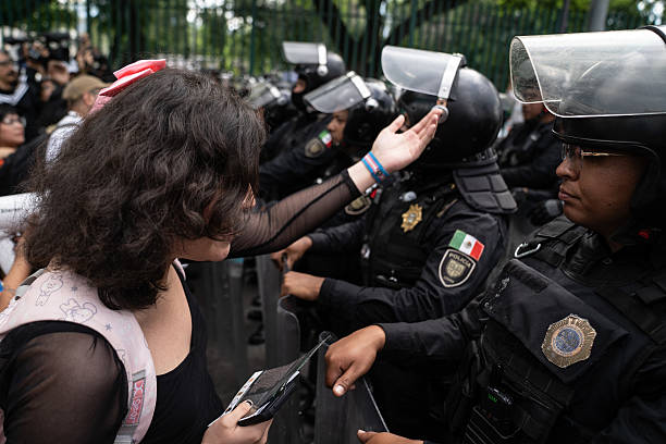 mexico-city-mexico-a-protester-talks-with-the-police-during-a-protest-against-gentrification.jpg